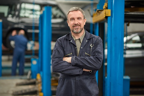 man standing in workshop